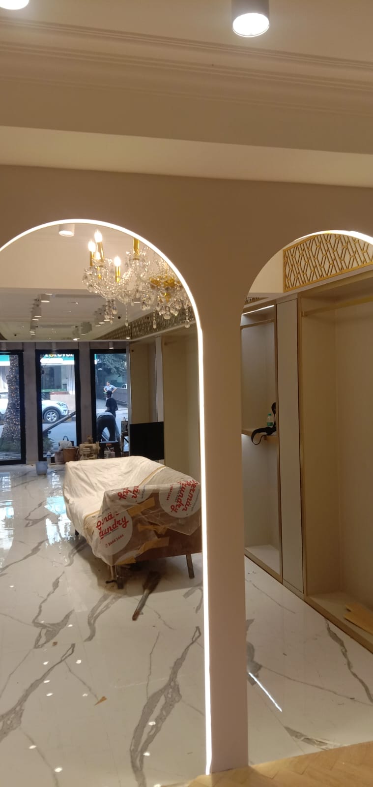 Illuminated Arch Portals & Crystal Chandelier Reflection